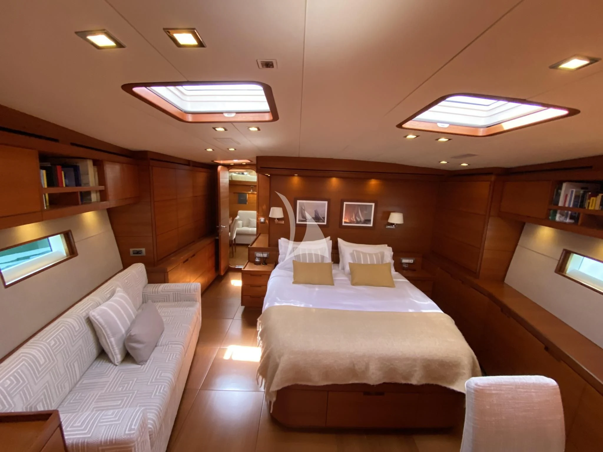 a room with a bed and a couch aboard ACAIA Yacht for Sale