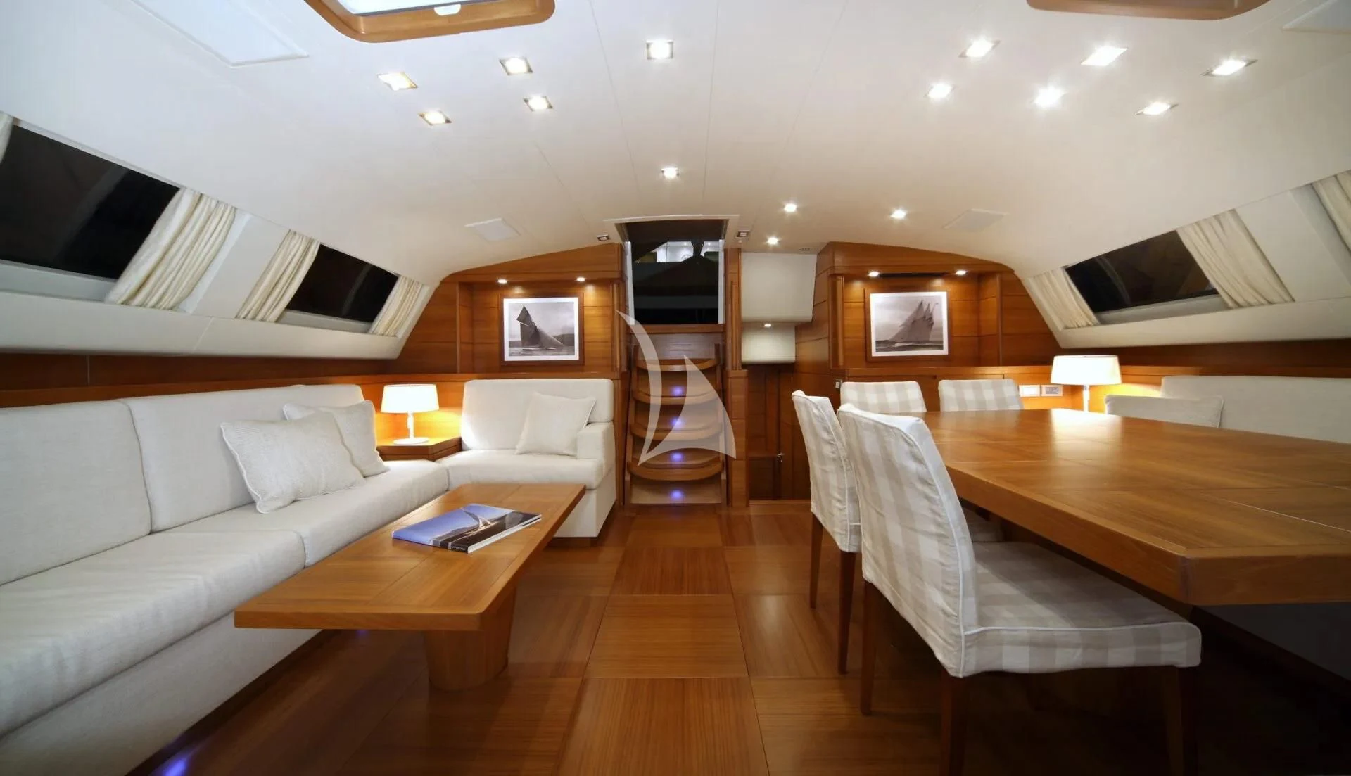 a room with a couch and a table aboard ACAIA Yacht for Sale