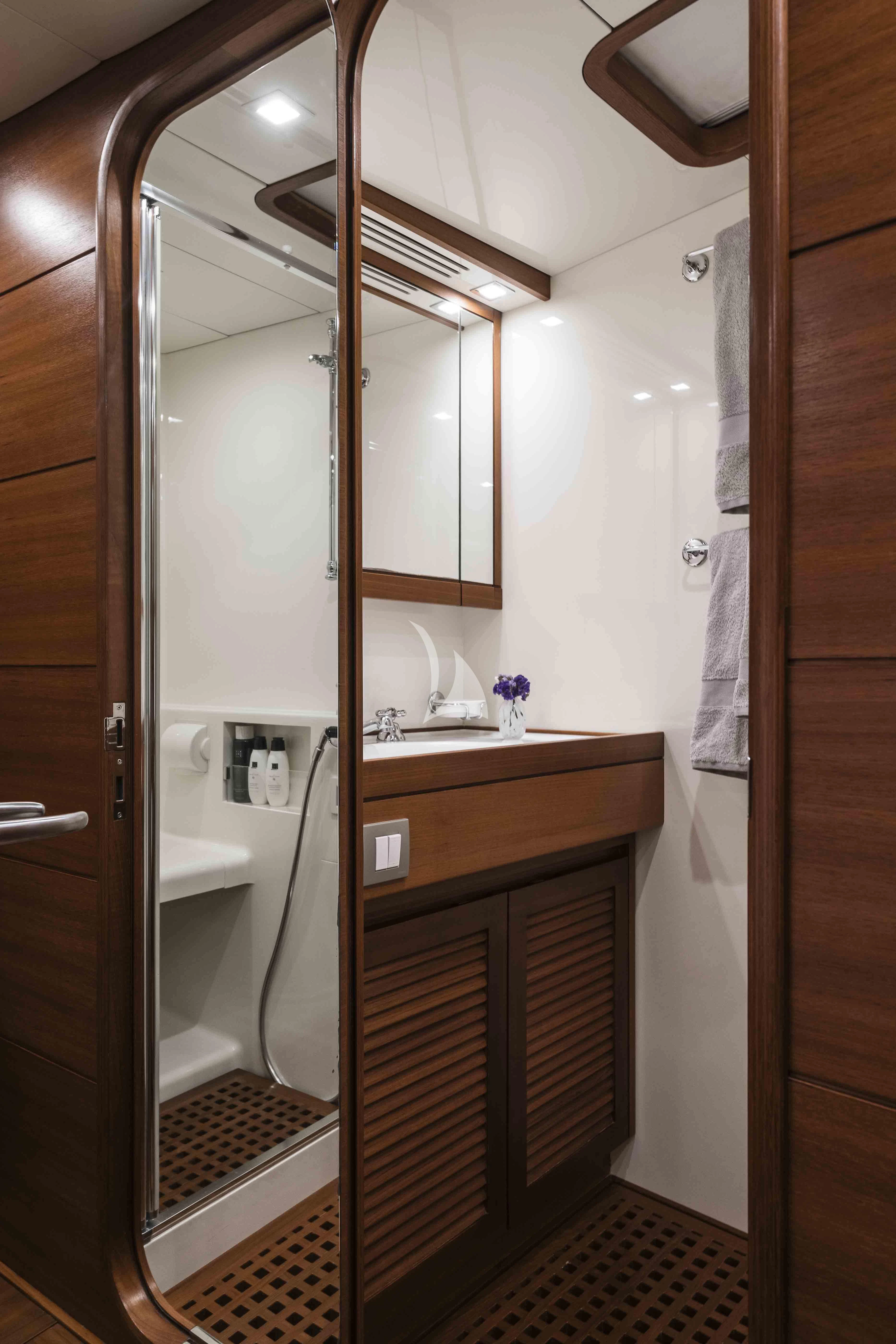 a bathroom with a shower unit and sink aboard ACAIA Yacht for Sale