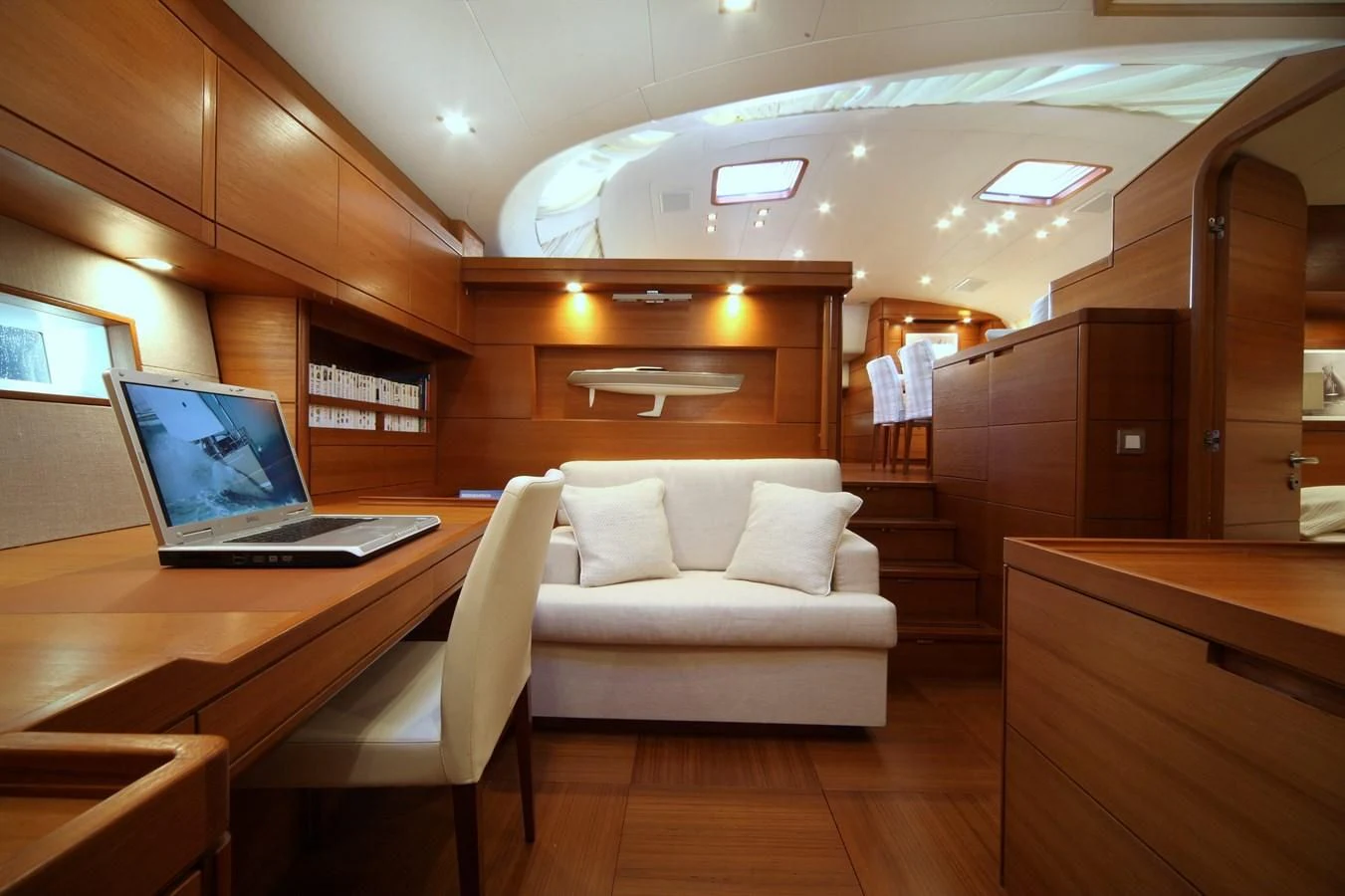 a room with a laptop and a couch aboard ACAIA Yacht for Sale
