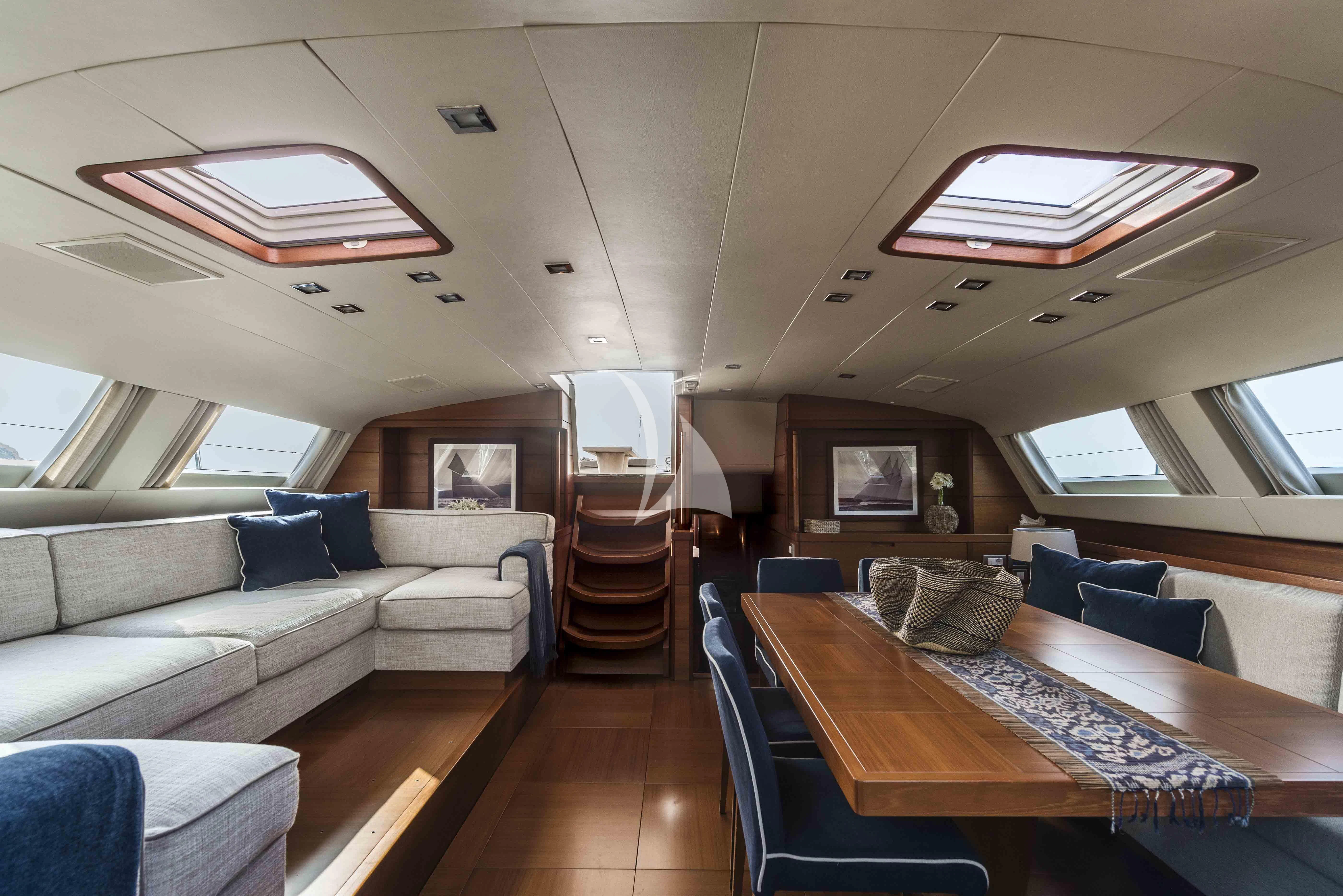 a living room with a large bed aboard ACAIA Yacht for Sale