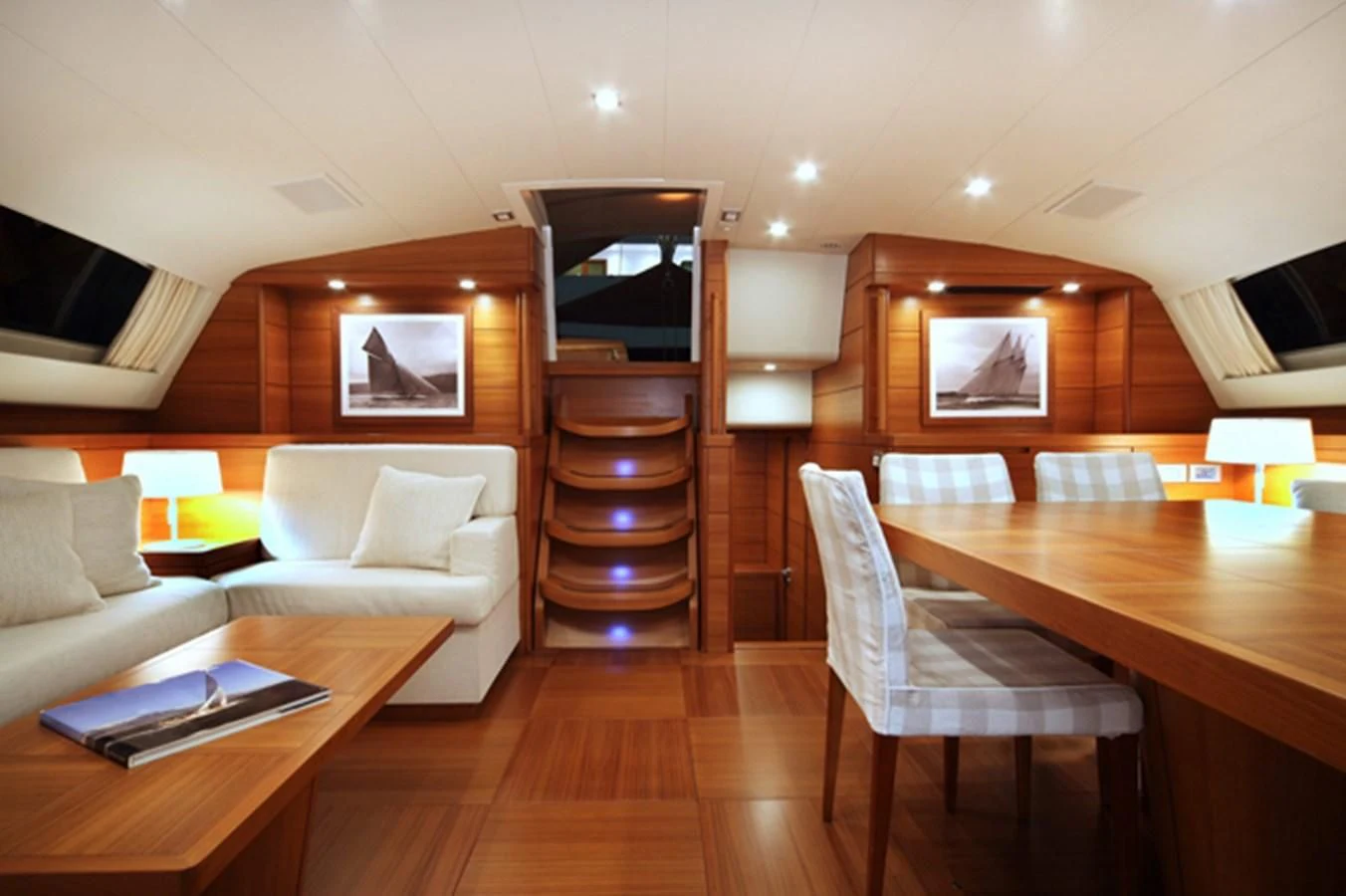 a room with a table and chairs aboard ACAIA Yacht for Sale