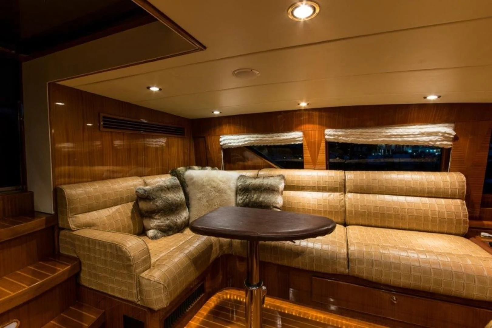a couch and coffee table in a room aboard DUNIA Yacht for Sale