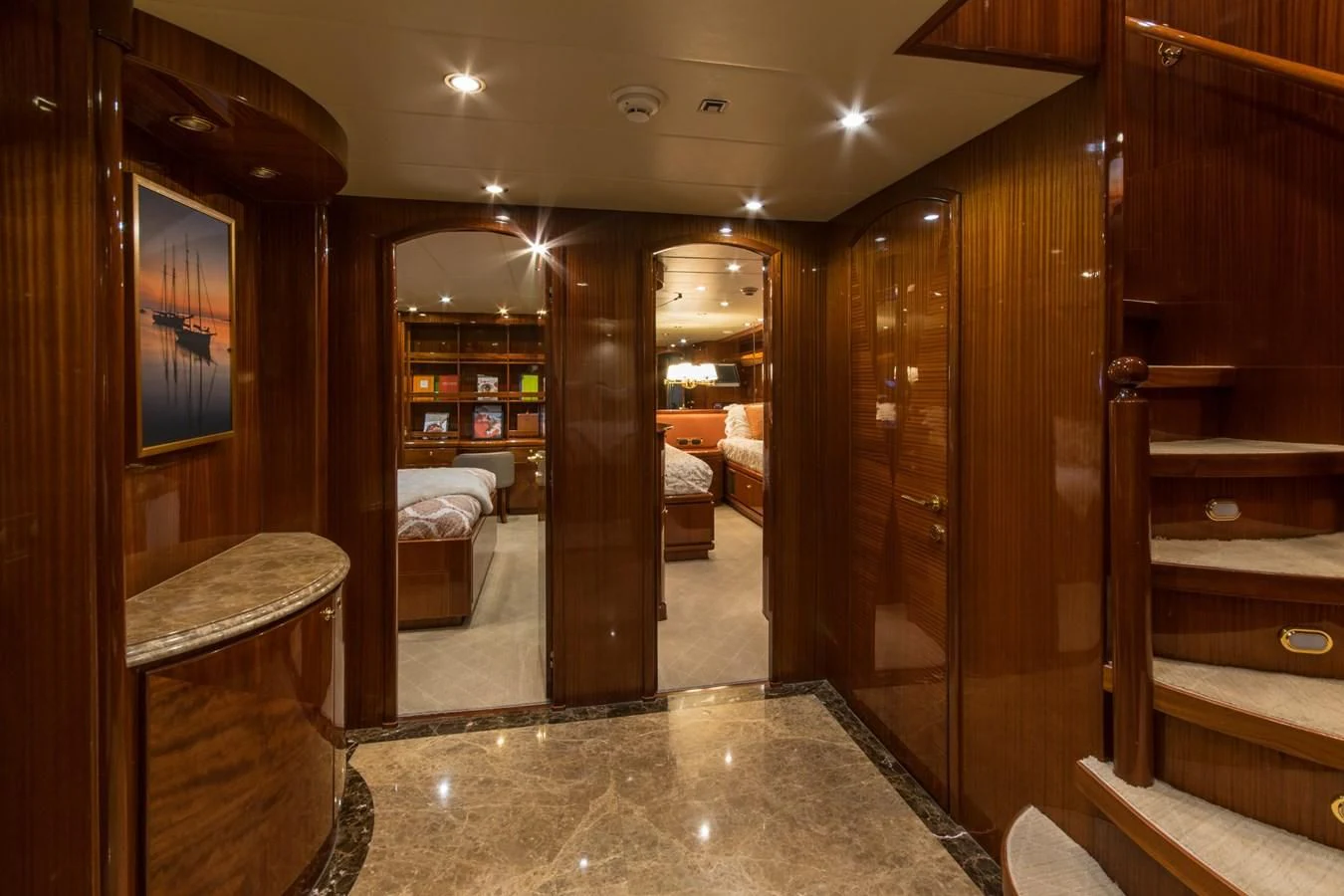 a room with wooden furniture aboard DUNIA Yacht for Sale