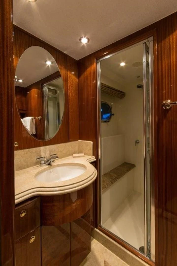 a bathroom with a sink and a mirror aboard DUNIA Yacht for Sale