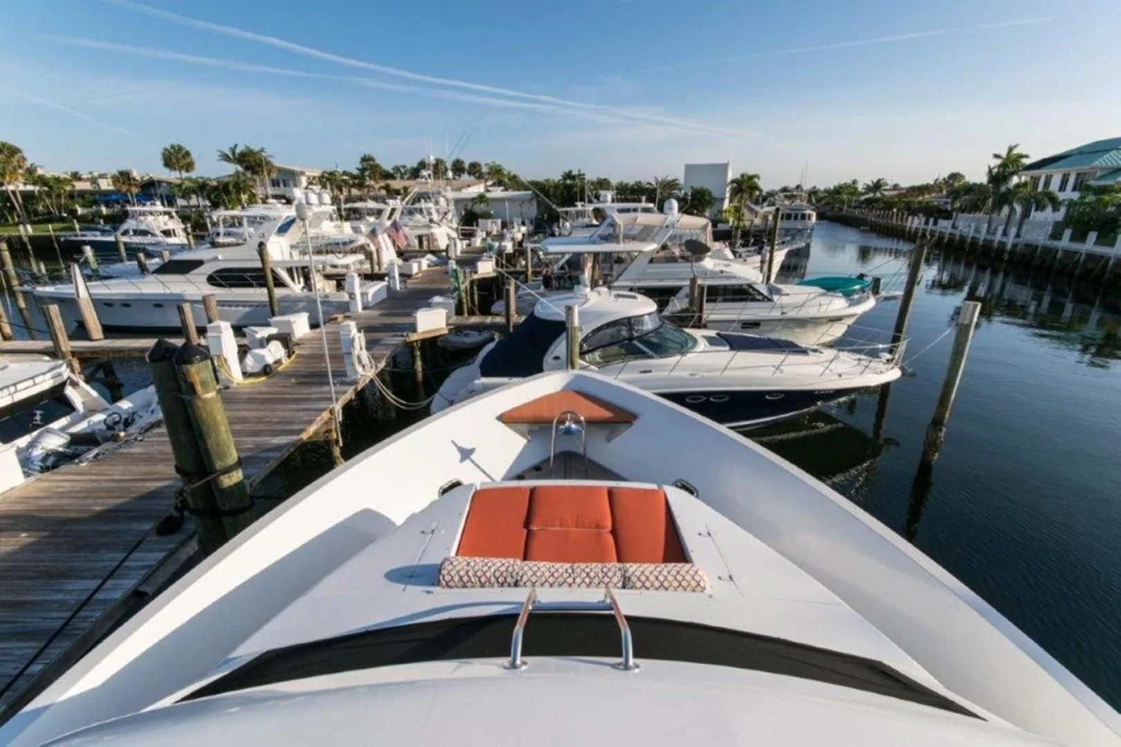 a boat dock with many boats aboard DUNIA Yacht for Sale
