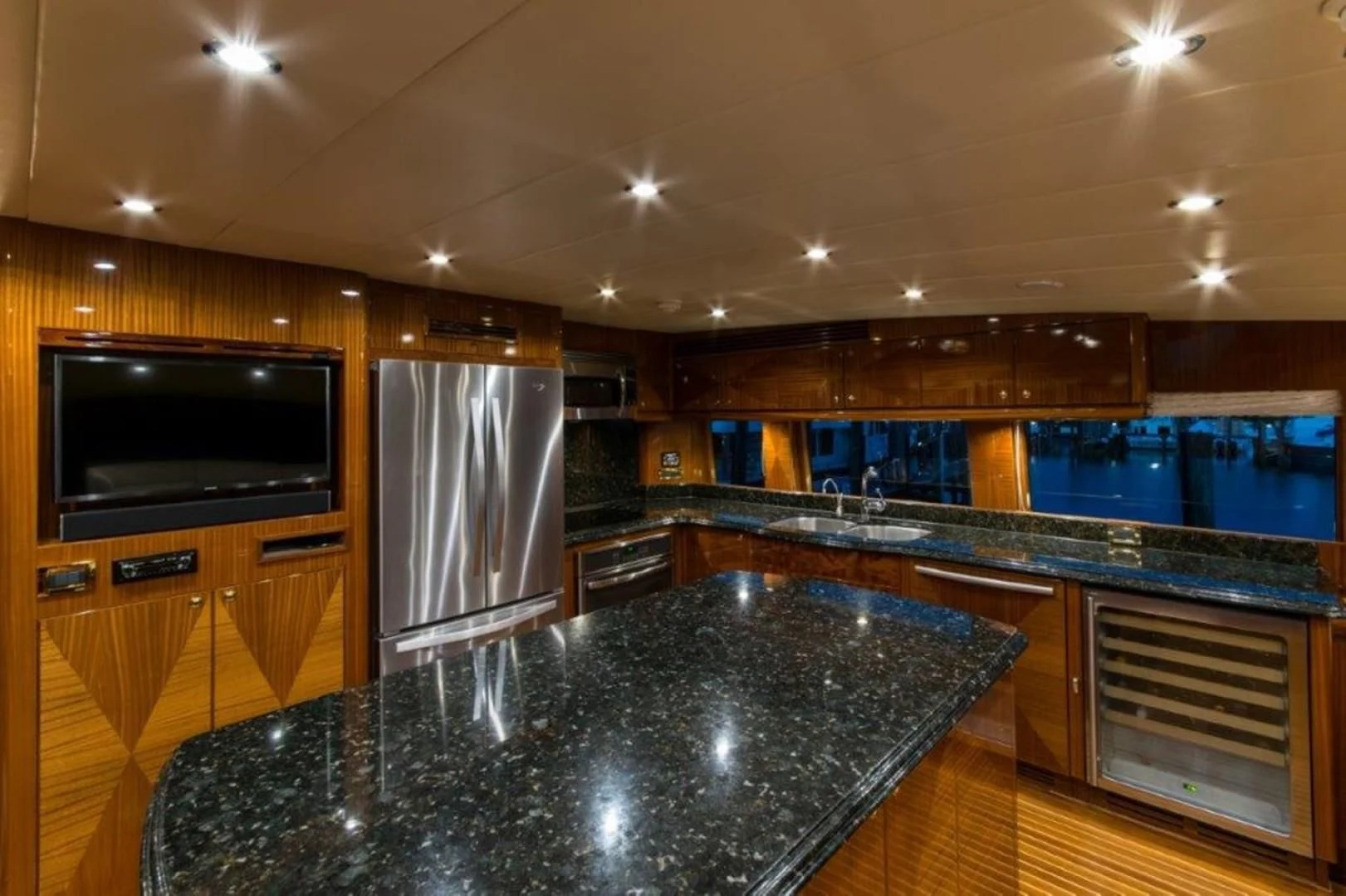 a large kitchen with a large marble counter top aboard DUNIA Yacht for Sale