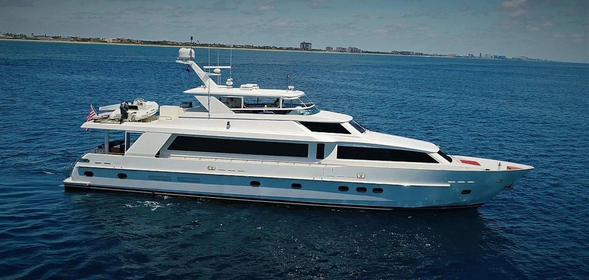 a white yacht in the water aboard DUNIA Yacht for Sale