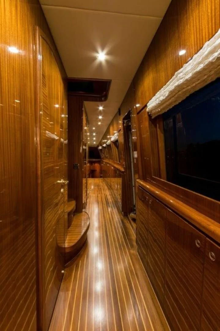 a hallway with wood walls aboard DUNIA Yacht for Sale