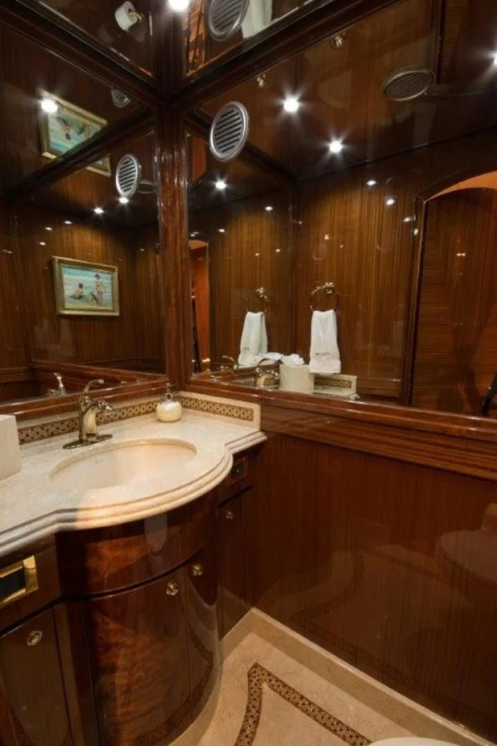 a bathroom with a large mirror aboard DUNIA Yacht for Sale