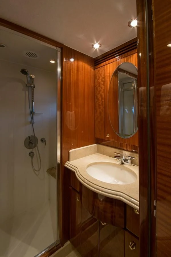 a bathroom with a sink and a mirror aboard DUNIA Yacht for Sale