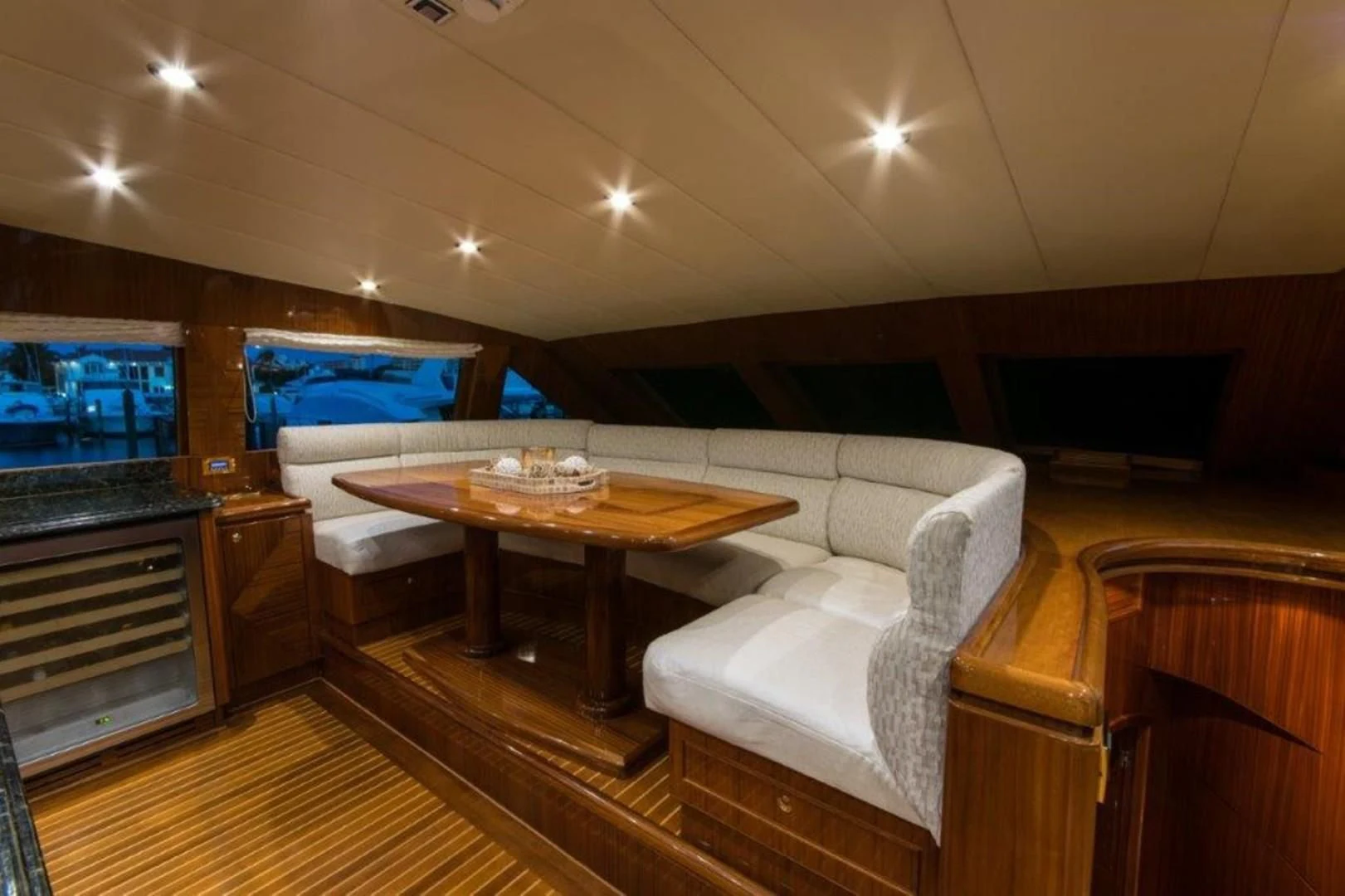 a room with a couch and a table aboard DUNIA Yacht for Sale