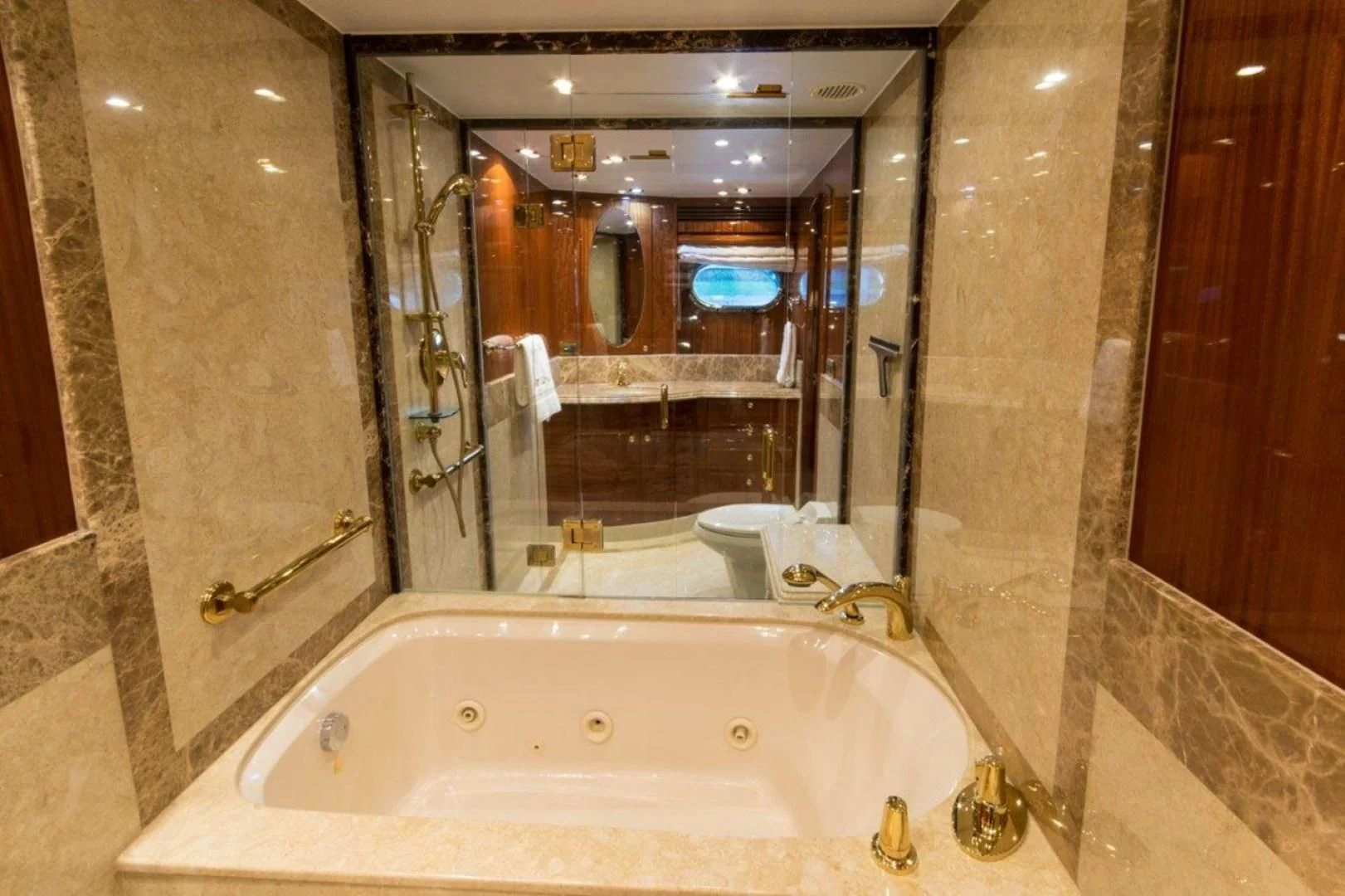 a bathroom with a large bathtub aboard DUNIA Yacht for Sale