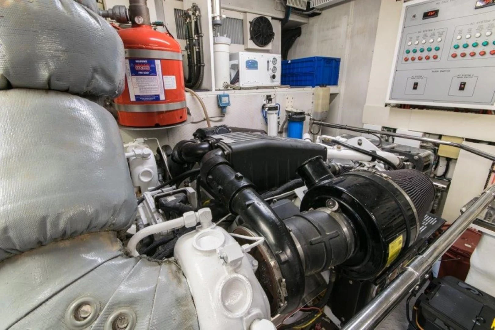 a car engine with a red bucket aboard DUNIA Yacht for Sale