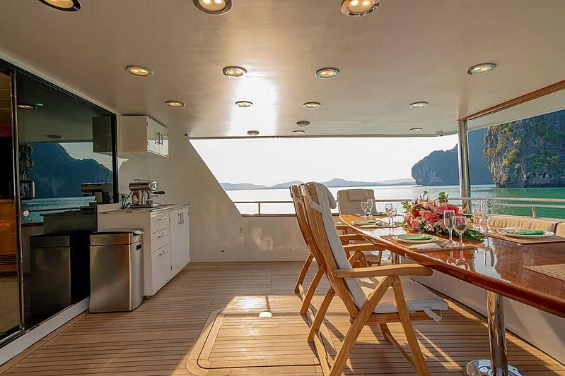 a kitchen and dining area aboard AJAO Yacht for Sale
