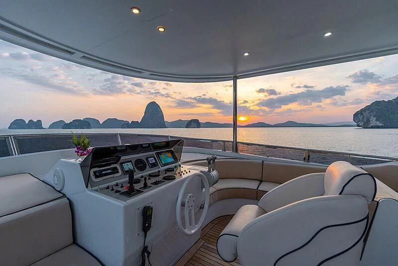 a car on a road with a sunset in the background aboard AJAO Yacht for Sale