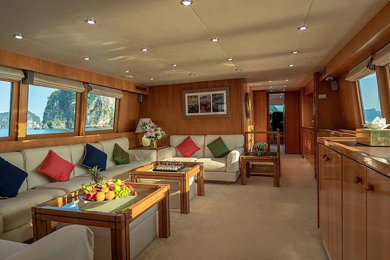 a living room with a couch and a coffee table aboard AJAO Yacht for Sale