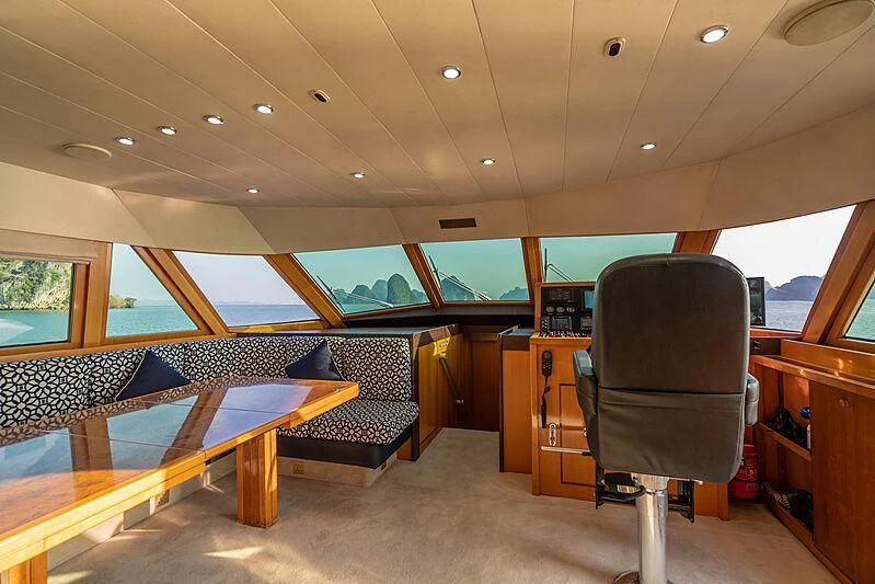 a room with a couch and a chair aboard AJAO Yacht for Sale