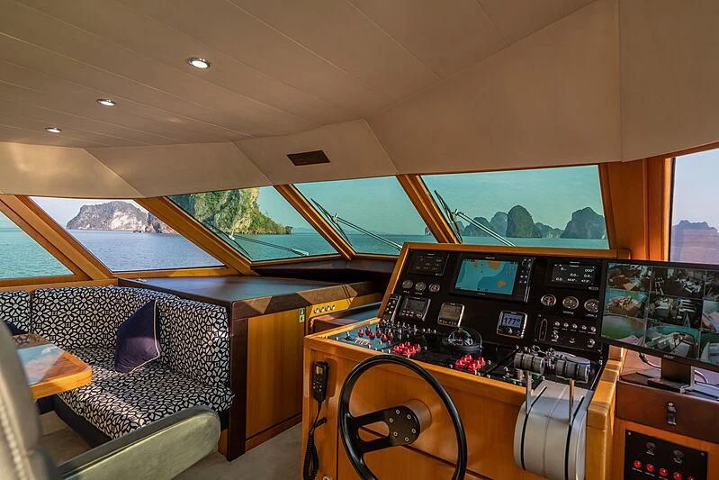 inside of a vehicle with a large screen and a large window aboard AJAO Yacht for Sale