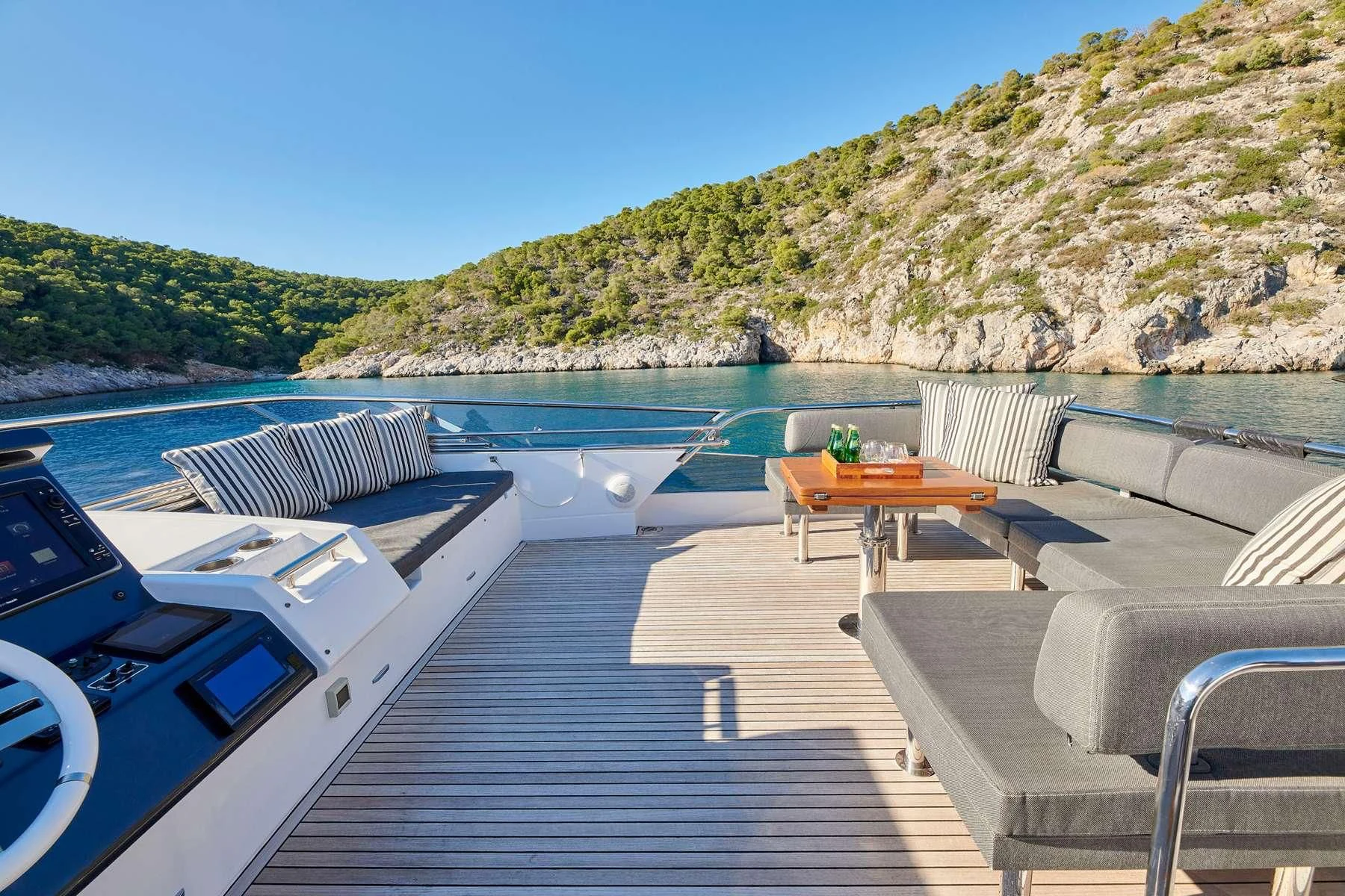 a dock with a table and chairs on it aboard ALKYONE Yacht for Sale