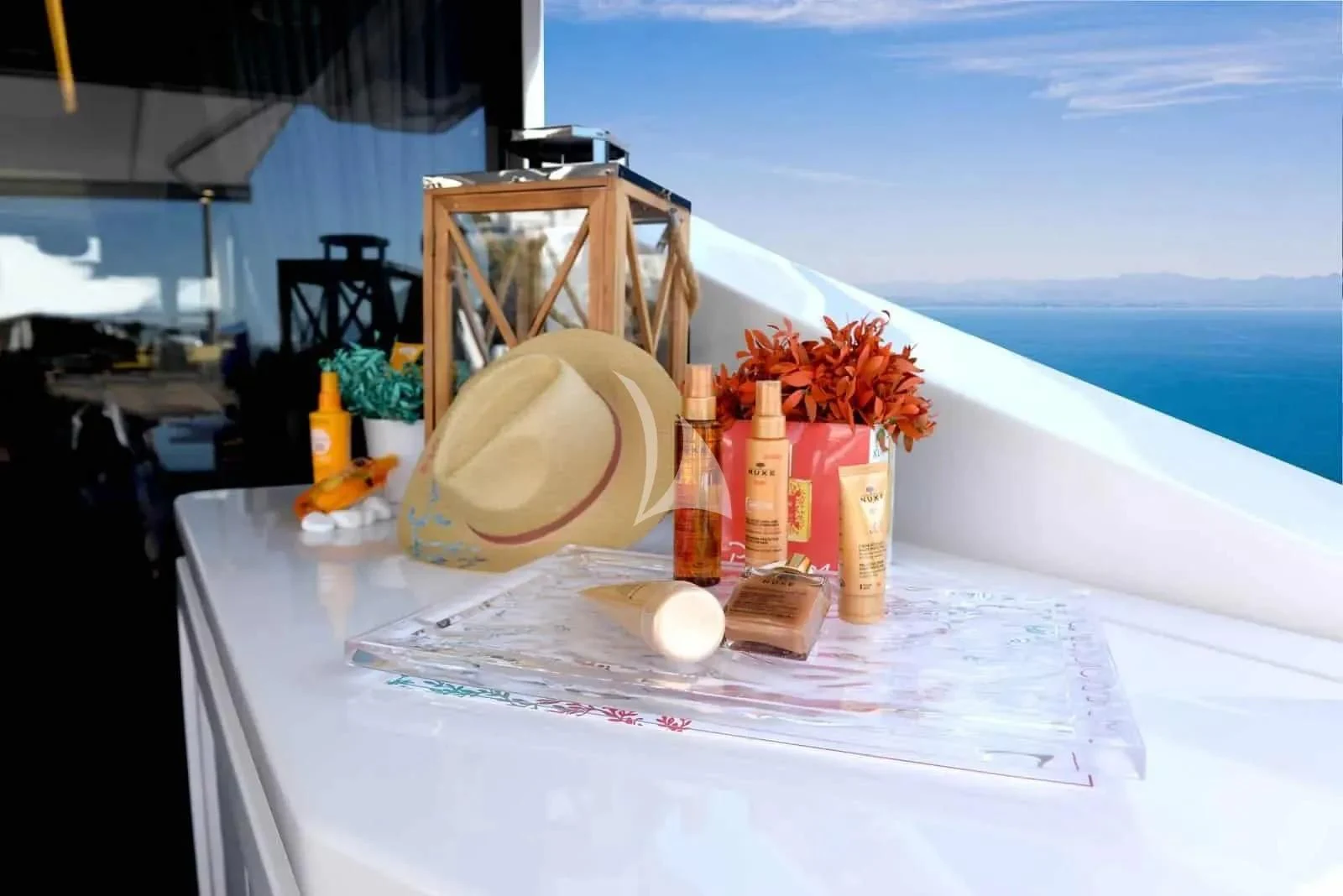a table with a hat and bottles on it aboard ALKYONE Yacht for Sale