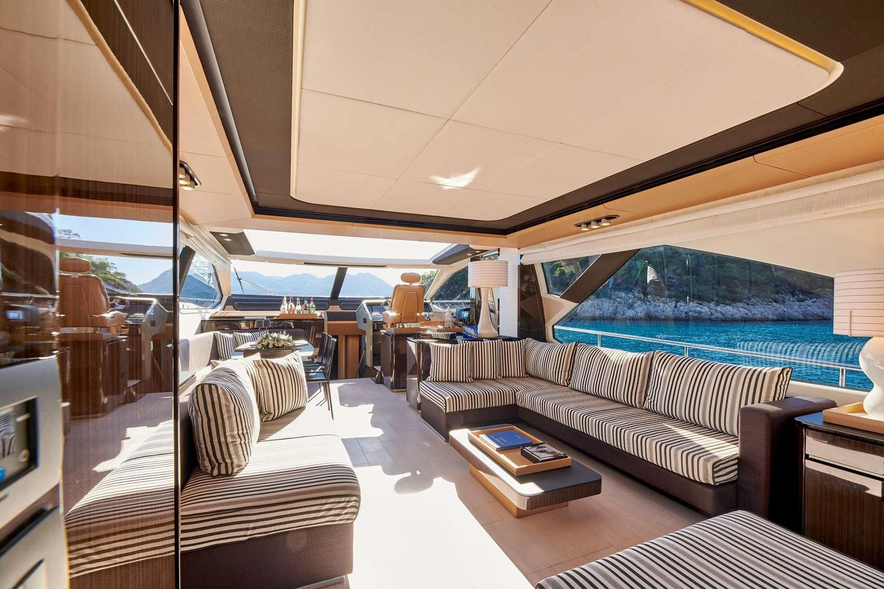 a room with a bed and a table aboard ALKYONE Yacht for Sale