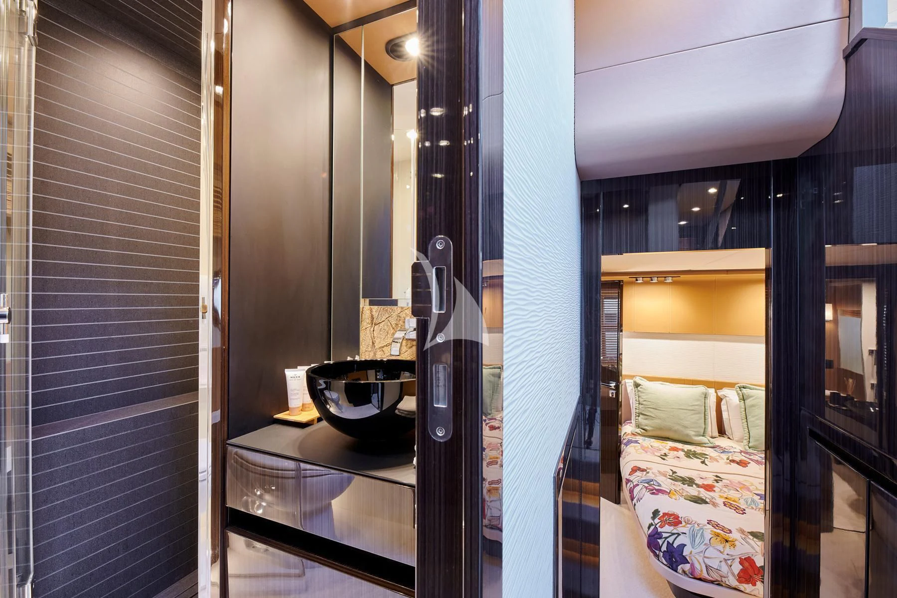 a bathroom with a sink and a bed aboard ALKYONE Yacht for Sale