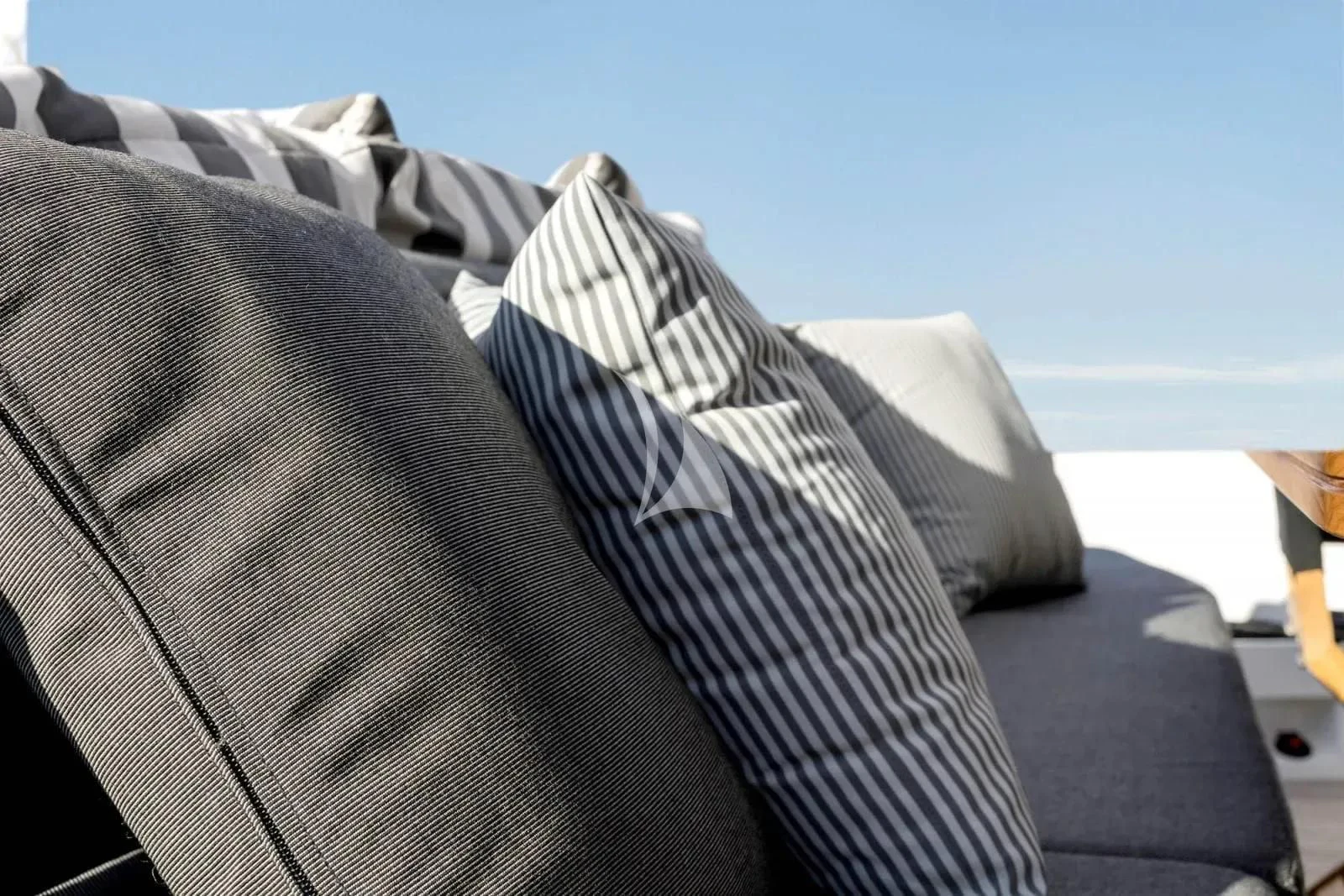 a person wearing a black and white striped shirt aboard ALKYONE Yacht for Sale