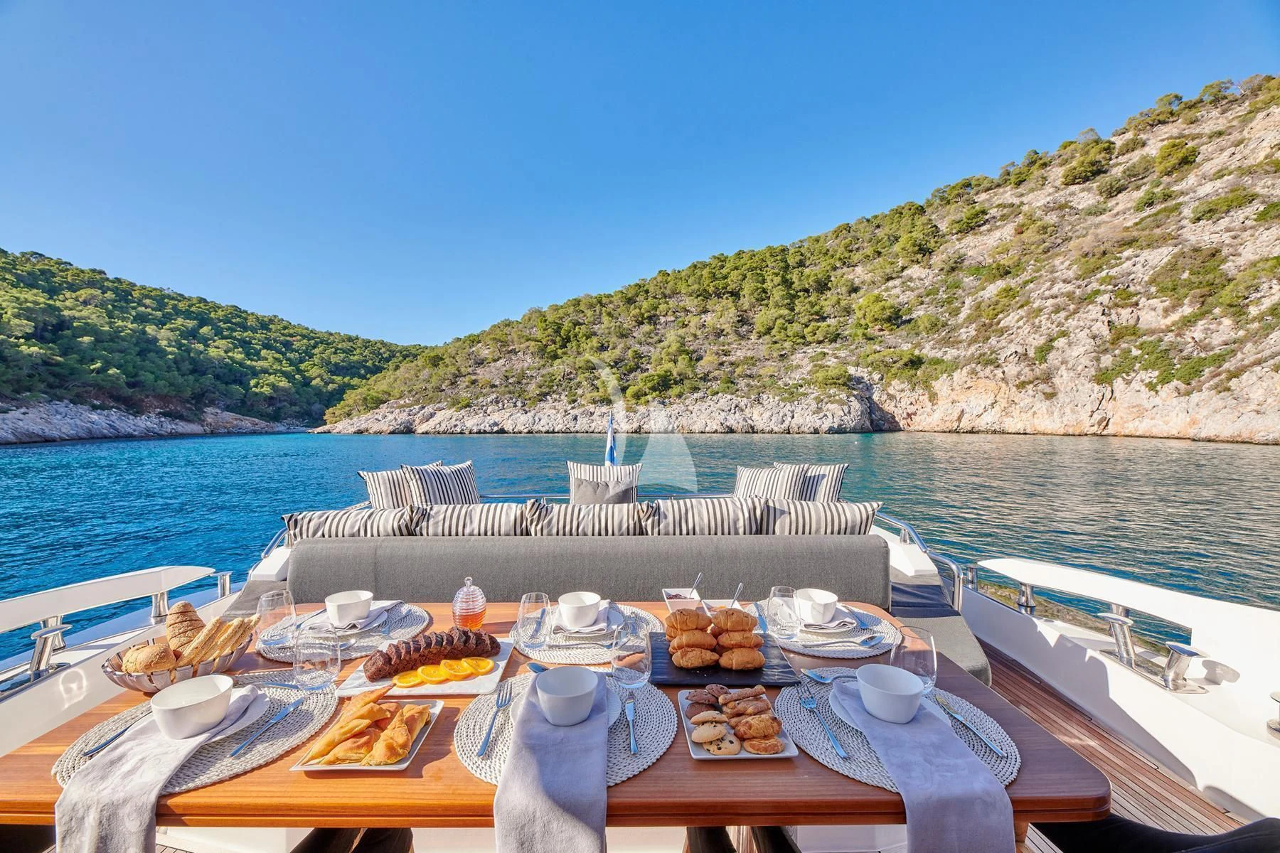 a table with food on it aboard ALKYONE Yacht for Sale