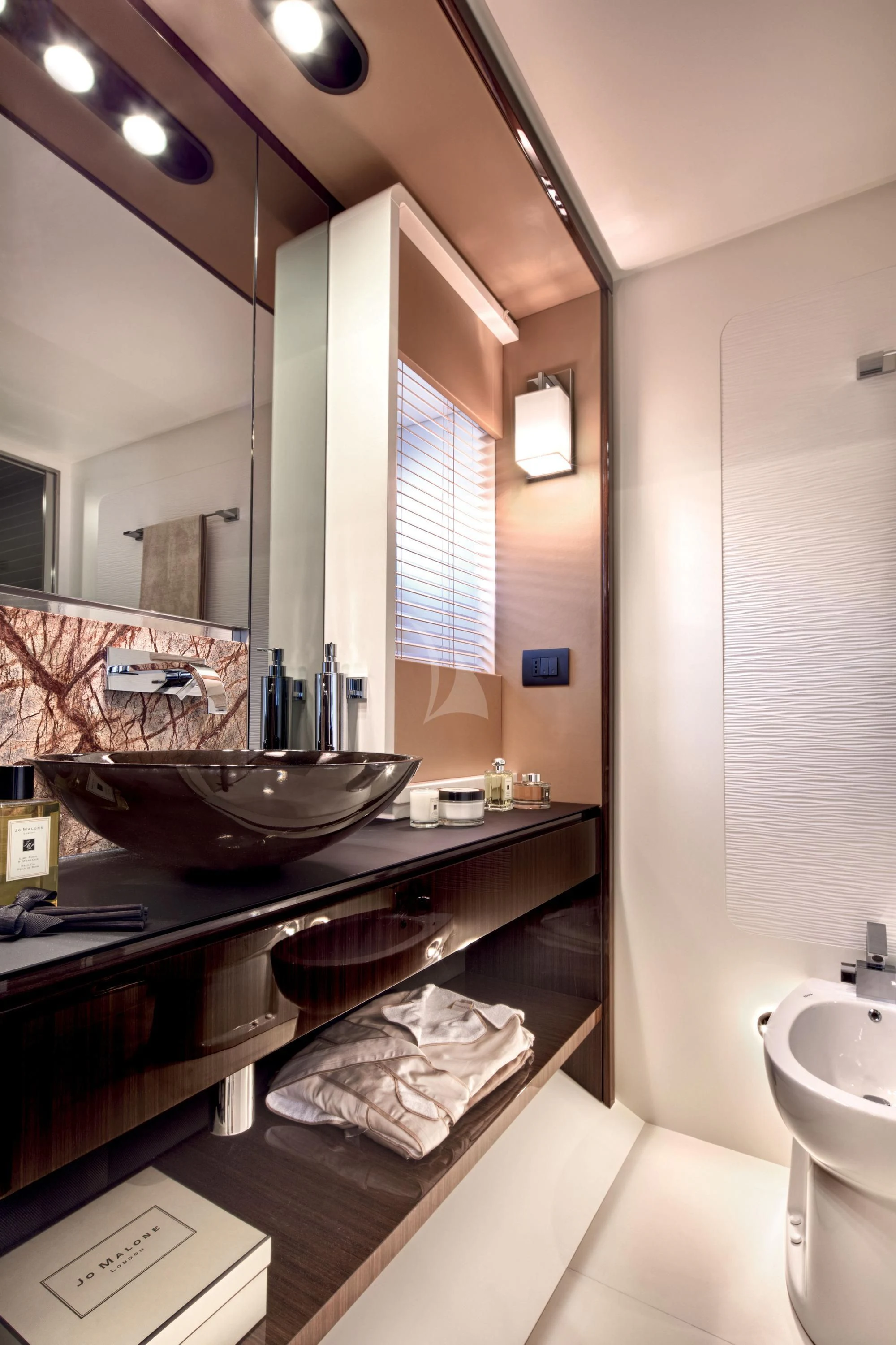 a bathroom with a large mirror aboard ALKYONE Yacht for Sale
