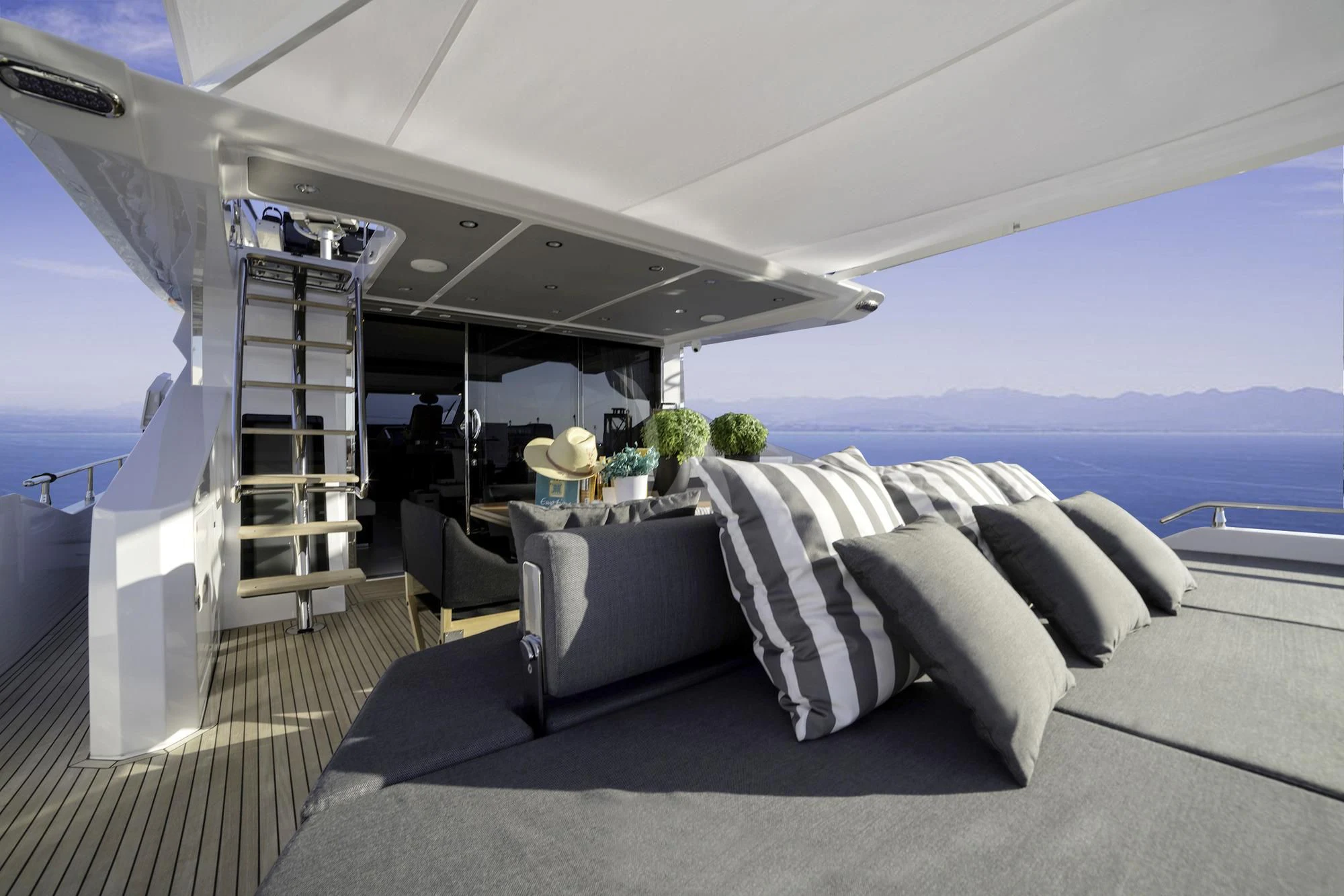a room with a couch and a ladder aboard ALKYONE Yacht for Sale