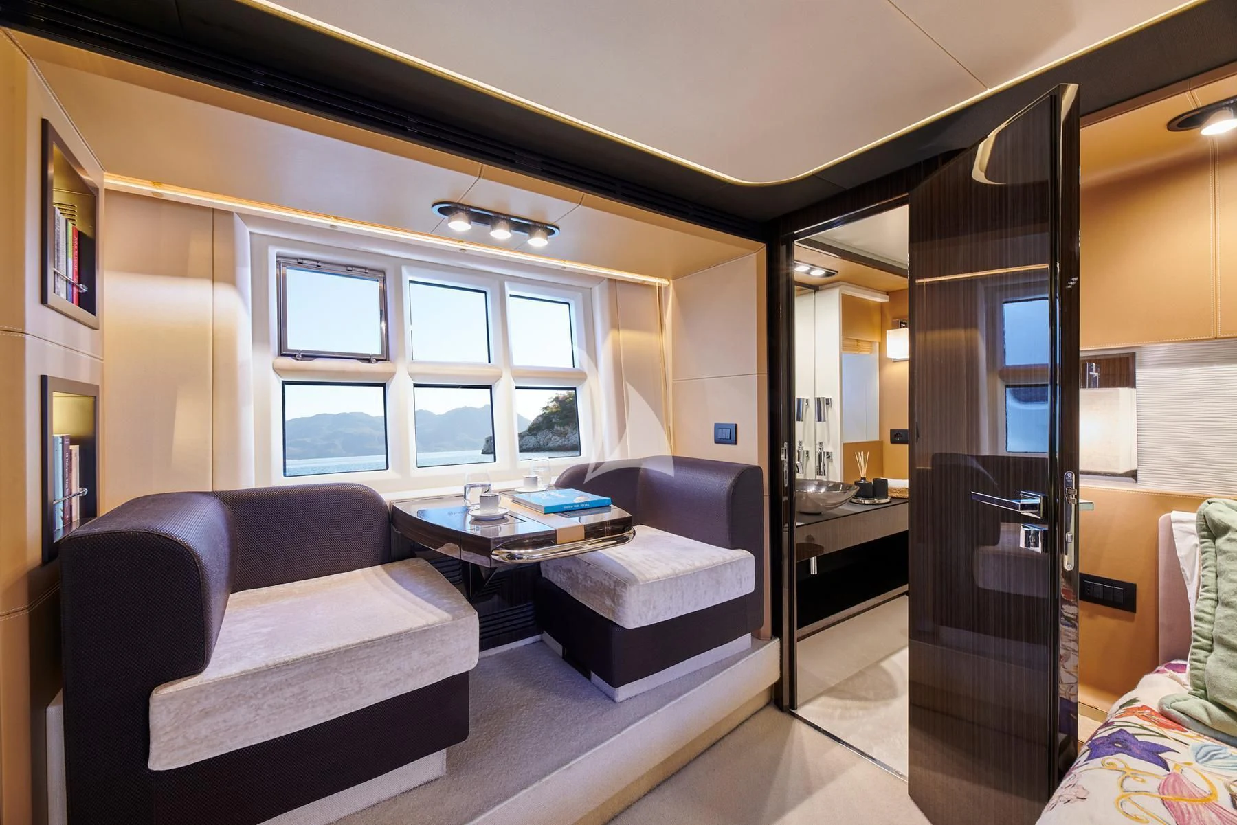 a living room with a couch and a coffee table aboard ALKYONE Yacht for Sale
