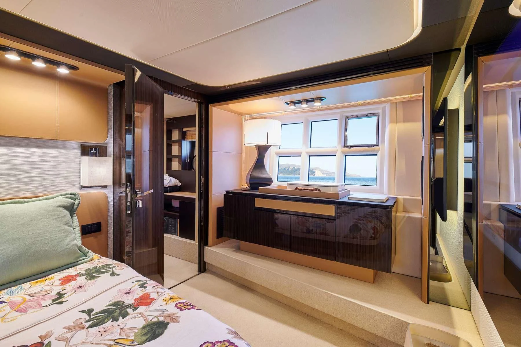 a bedroom with a bed and a desk aboard ALKYONE Yacht for Sale