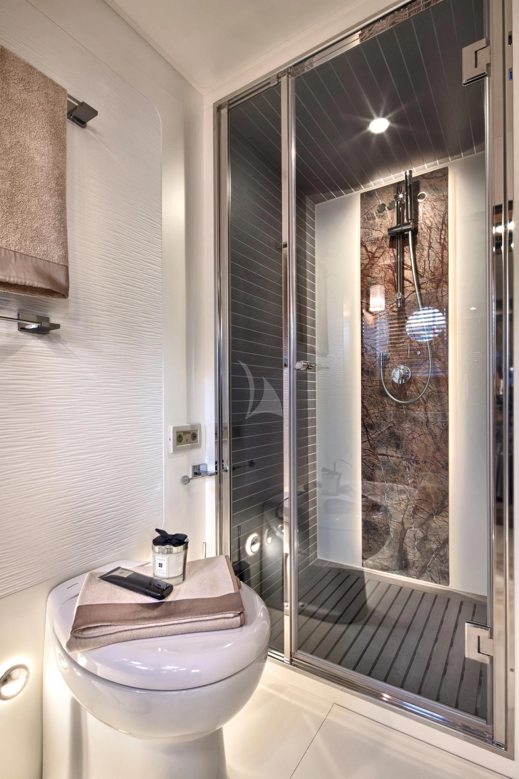 a bathroom with a glass shower aboard ALKYONE Yacht for Sale