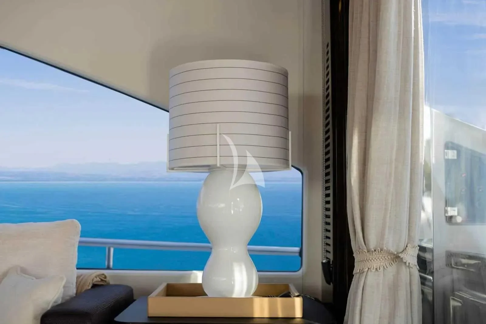a lamp on a table aboard ALKYONE Yacht for Sale