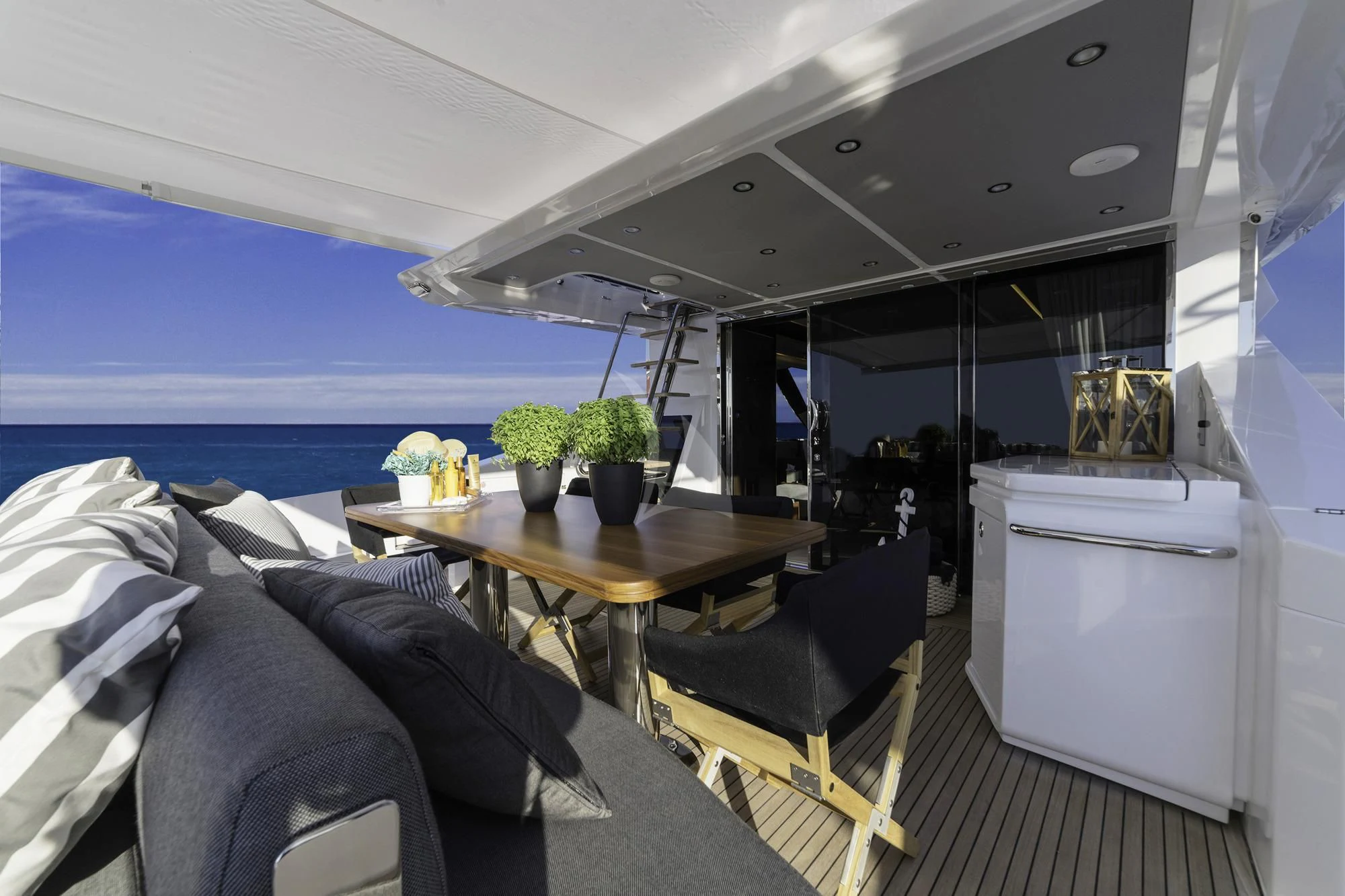 a room with a table and chairs aboard ALKYONE Yacht for Sale
