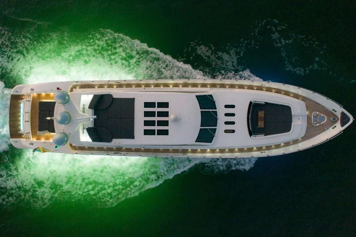 a small white helicopter in the air aboard LEOPARD Yacht for Sale