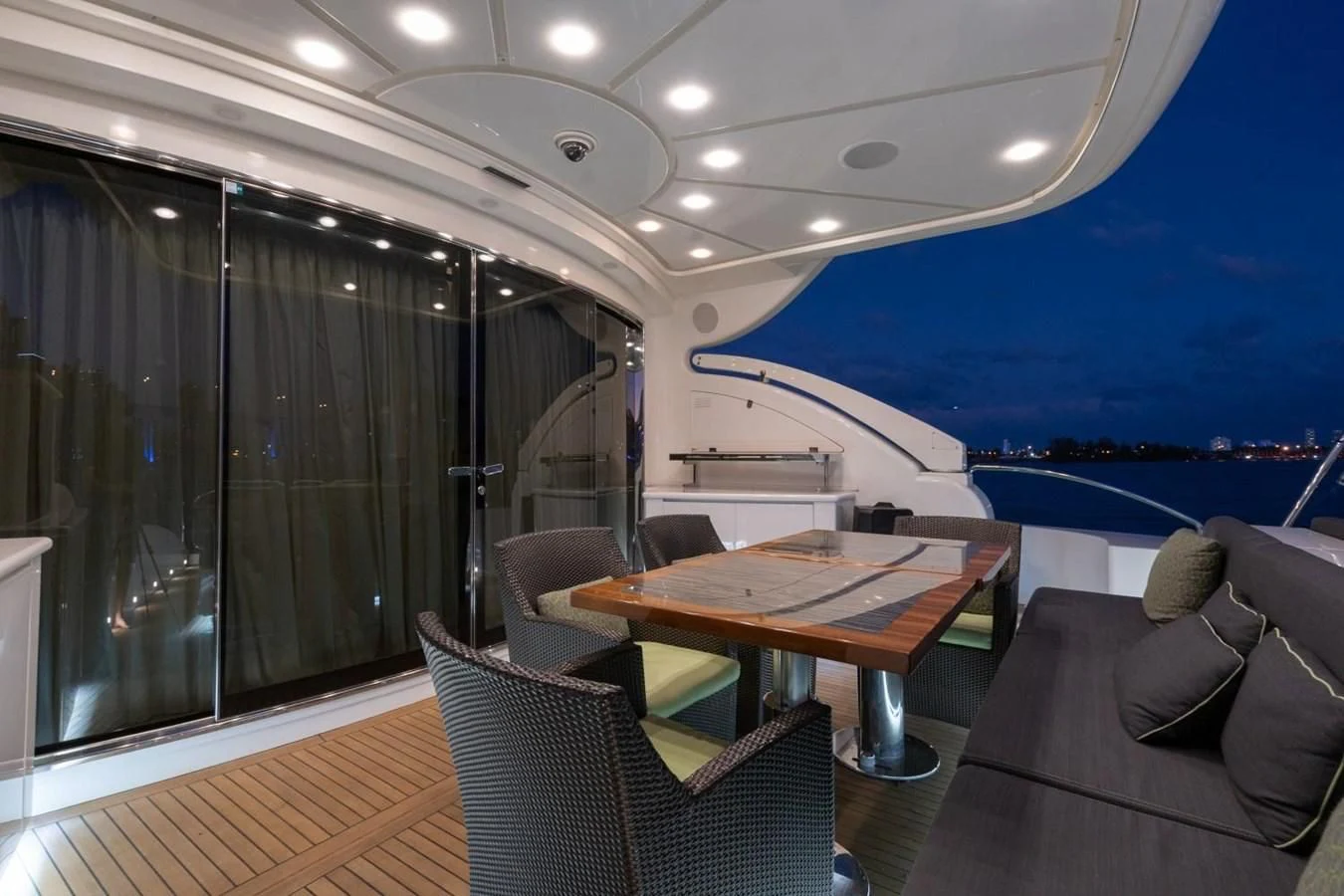 a room with a table and chairs aboard LEOPARD Yacht for Sale