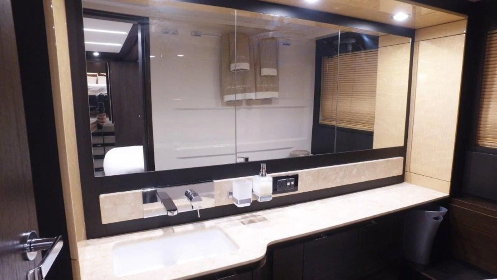 a bathroom with a large mirror aboard LEVATAR Yacht for Sale