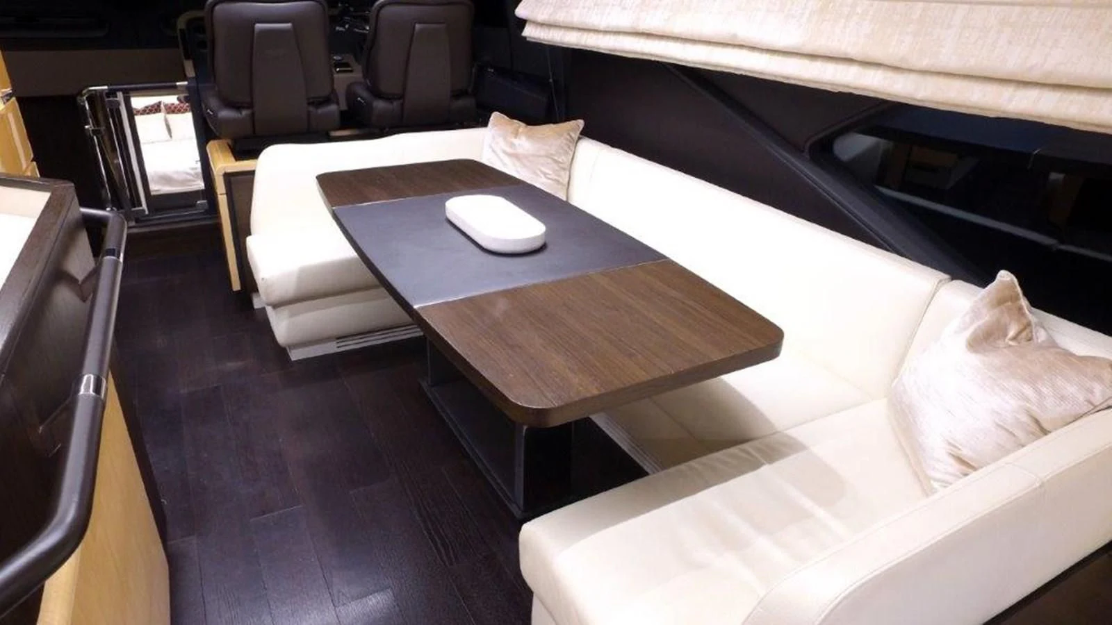 a table with chairs around it aboard LEVATAR Yacht for Sale