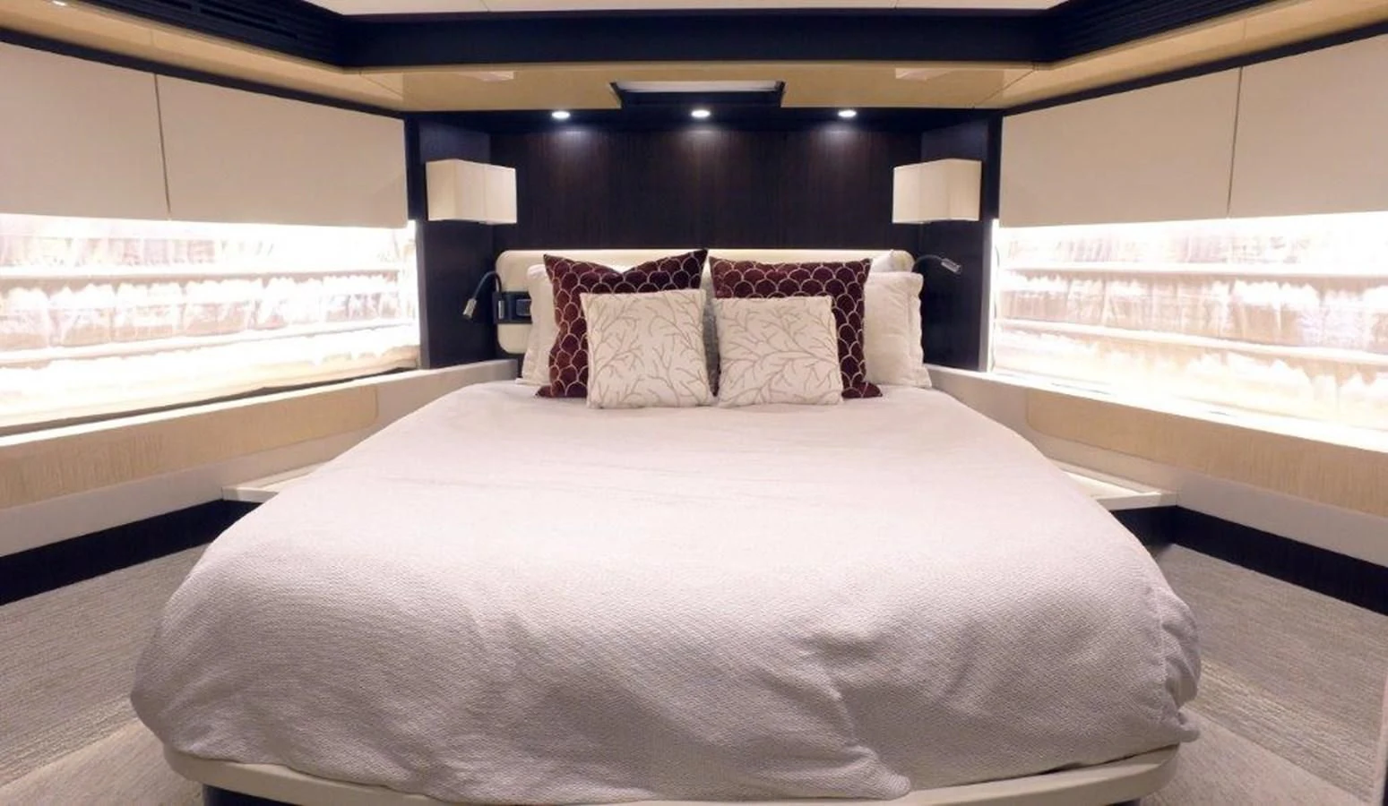 a bed with pillows aboard LEVATAR Yacht for Sale