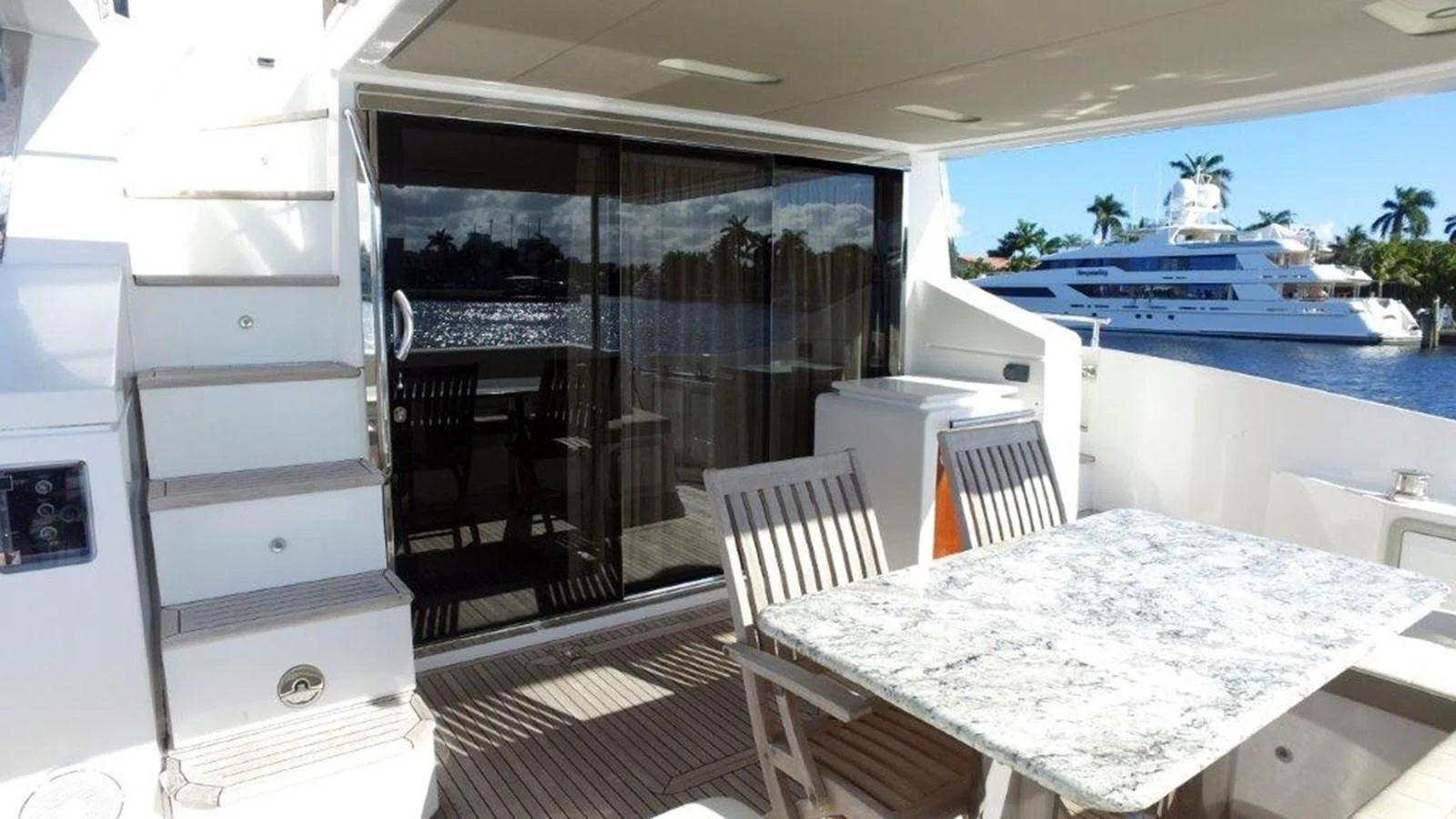 a room with a table and chairs aboard LEVATAR Yacht for Sale