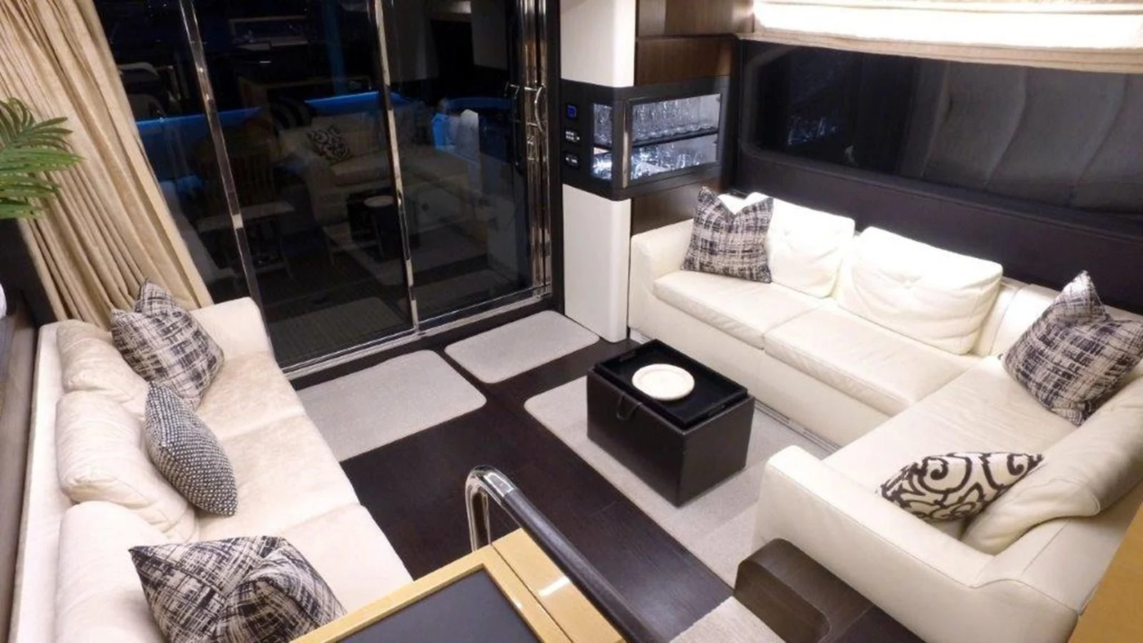 a living room with a large window aboard LEVATAR Yacht for Sale