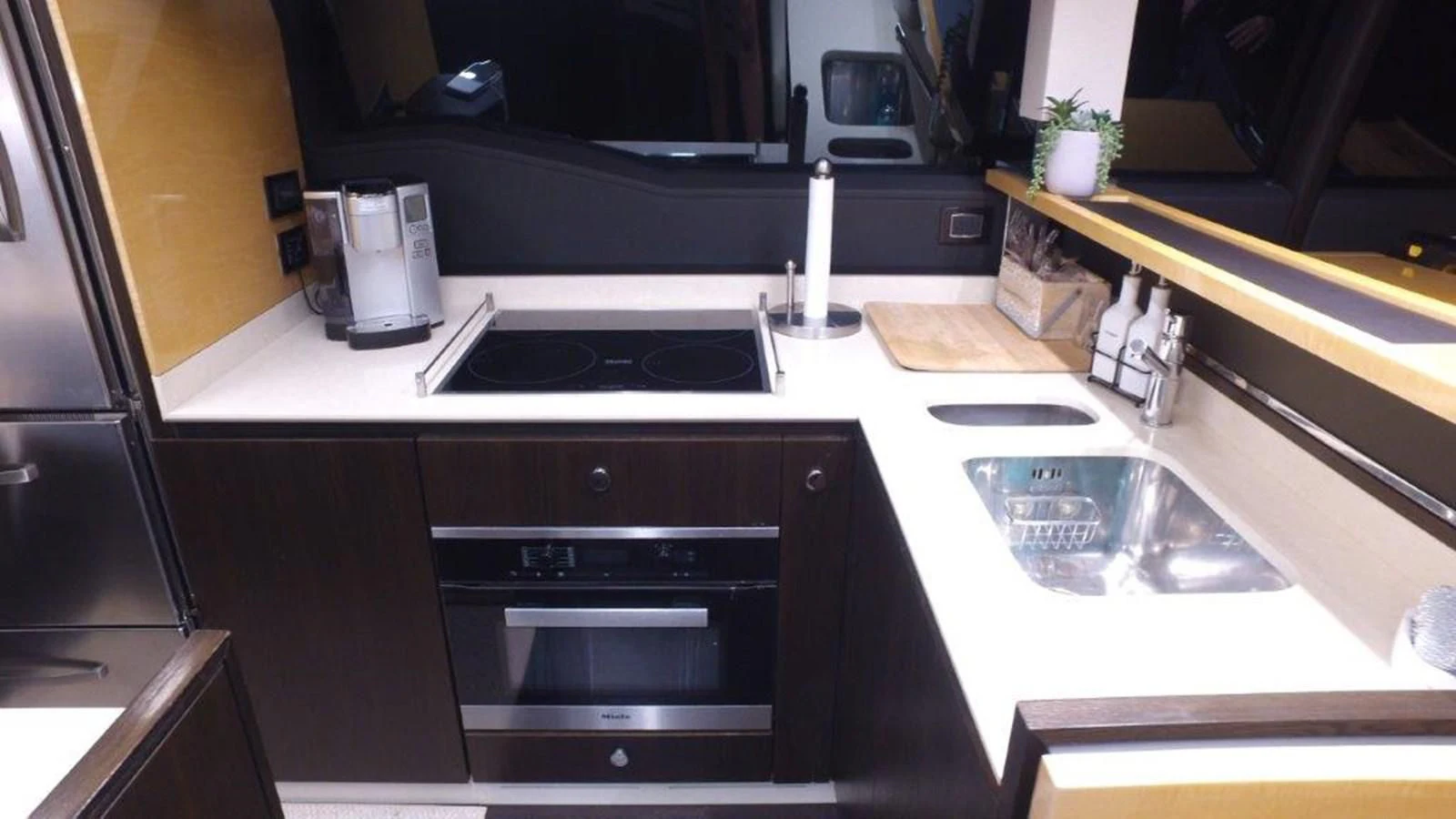 a kitchen with a sink and stove aboard LEVATAR Yacht for Sale
