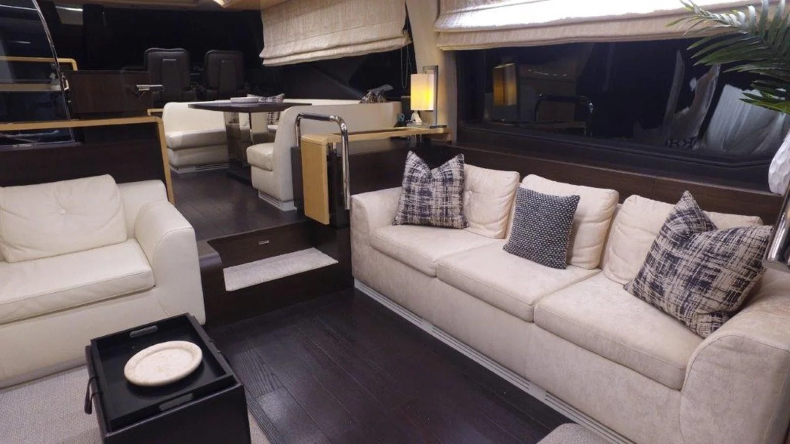 a living room with a couch and a table aboard LEVATAR Yacht for Sale