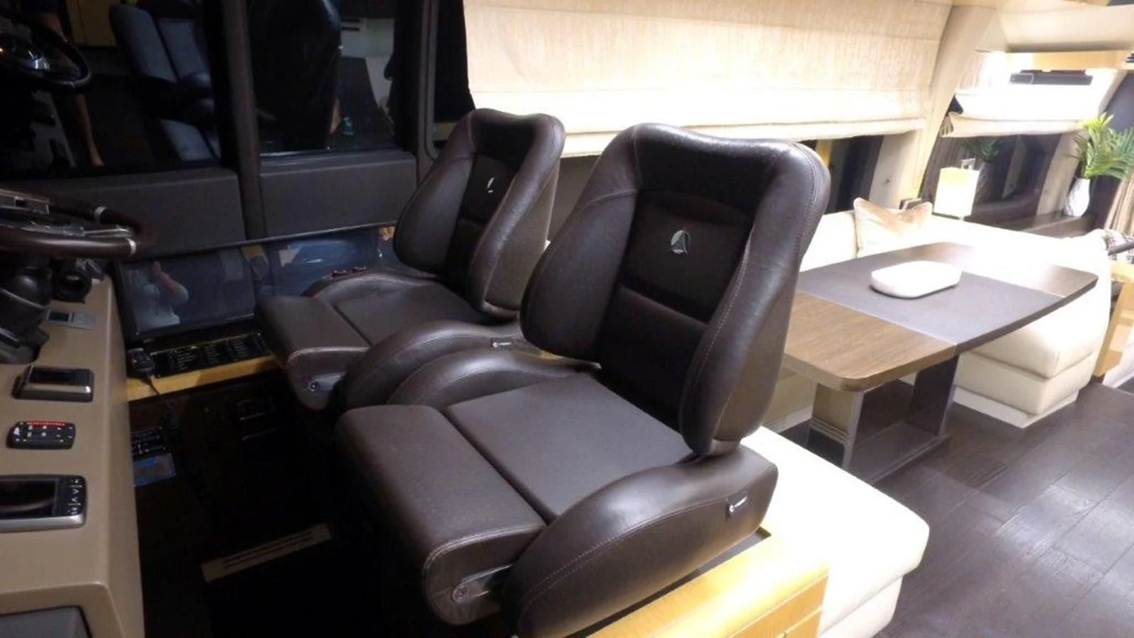 a room with a desk and chairs aboard LEVATAR Yacht for Sale