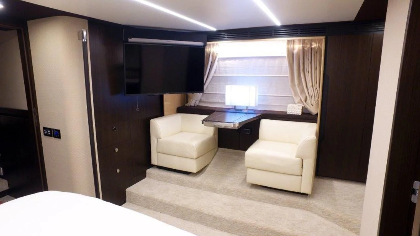 a room with a desk and a chair aboard LEVATAR Yacht for Sale
