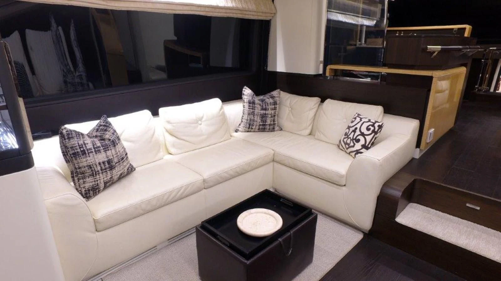 a white couch with pillows aboard LEVATAR Yacht for Sale