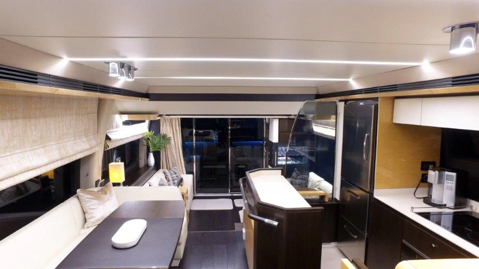 a room with a desk and a bed aboard LEVATAR Yacht for Sale