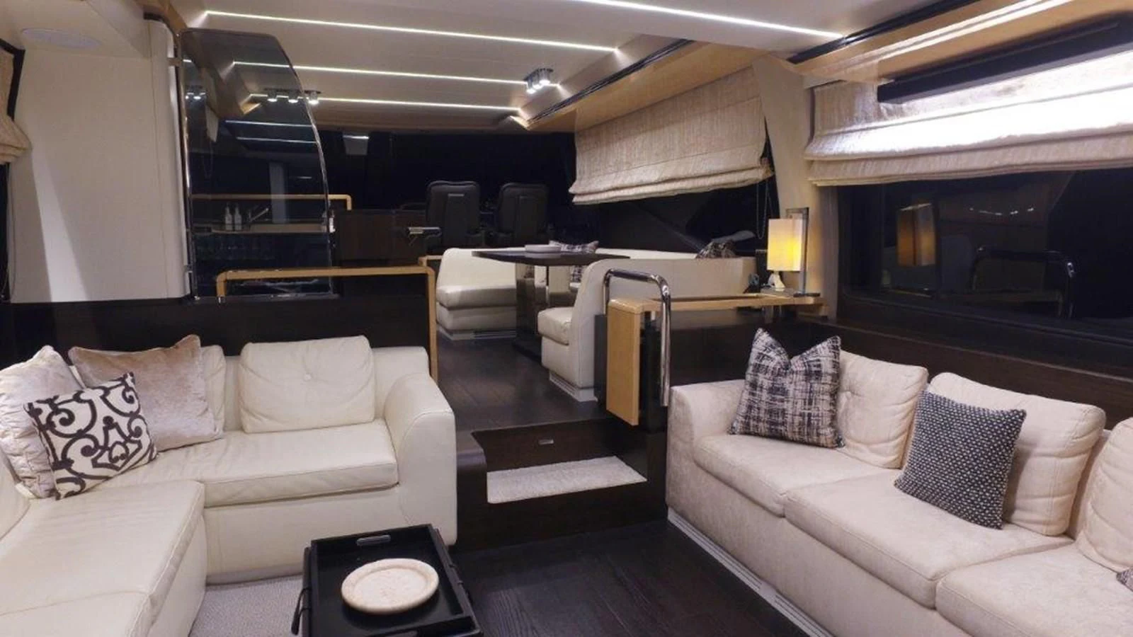 a living room with a couch and a table aboard LEVATAR Yacht for Sale